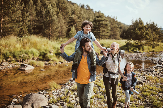 family walking on hike together