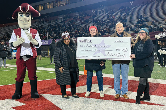UMassFive presents giant check to Amherst Cinema